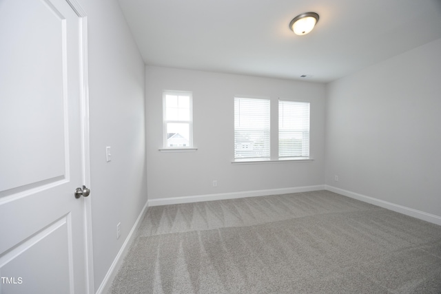 spare room featuring carpet flooring