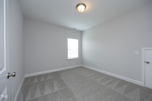 spare room featuring carpet floors