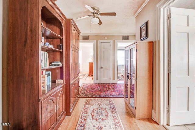 hallway with light wood-type flooring