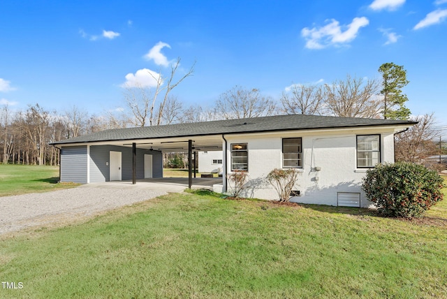 single story home with a front yard and a carport