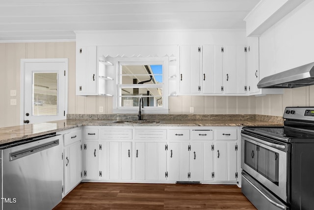 kitchen with light stone counters, white cabinetry, stainless steel appliances, and exhaust hood