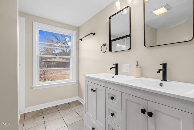 bathroom with tile patterned flooring and vanity