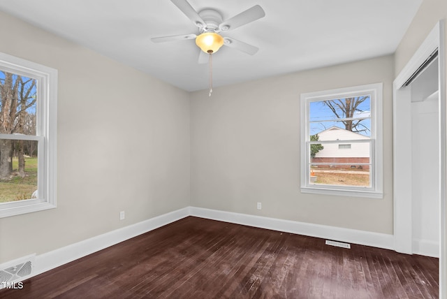 unfurnished room featuring hardwood / wood-style flooring and ceiling fan