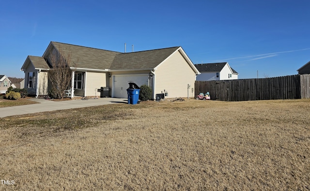 view of property exterior with a garage and a lawn