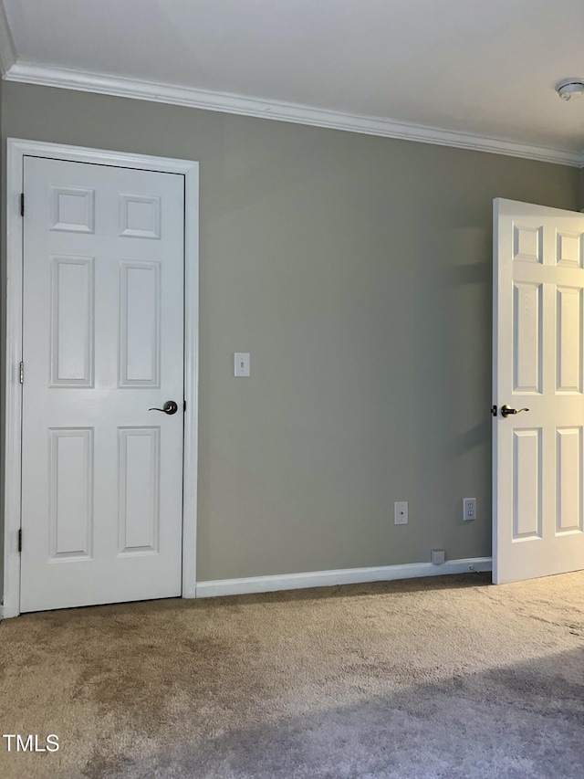 carpeted empty room with ornamental molding