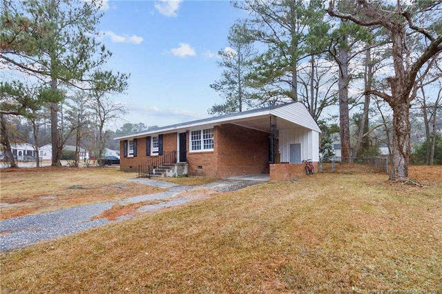 single story home with a front yard and a carport