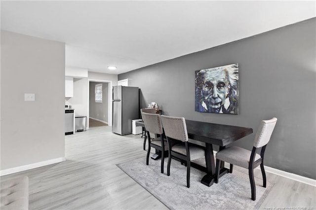 dining room featuring light hardwood / wood-style floors