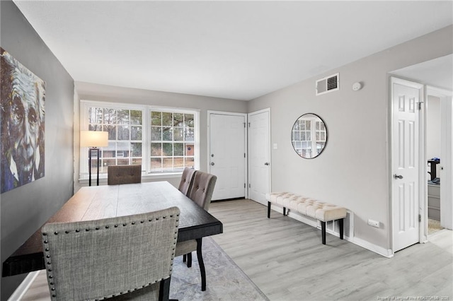 dining space featuring light hardwood / wood-style floors