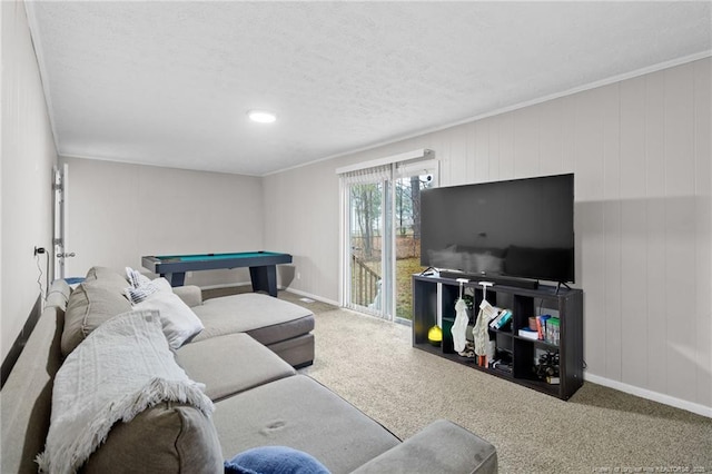 carpeted living room featuring crown molding and pool table