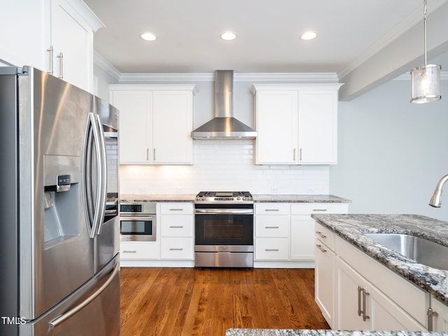 kitchen featuring white cabinetry, wall chimney exhaust hood, and stainless steel appliances