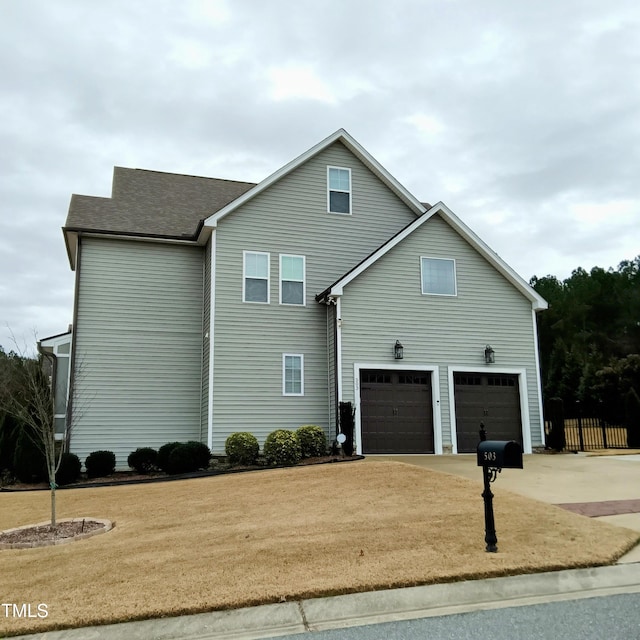 exterior space with a front yard and a garage