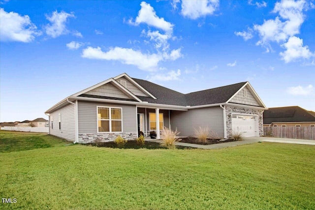 view of front facade featuring a front lawn and a garage