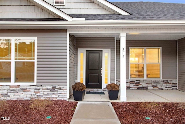 property entrance featuring a porch