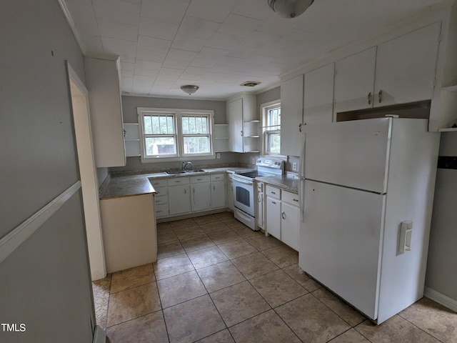 kitchen with white appliances, white cabinets, crown molding, sink, and light tile patterned floors