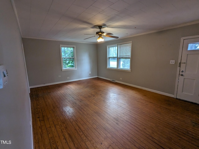 interior space with dark hardwood / wood-style flooring, ceiling fan, and crown molding