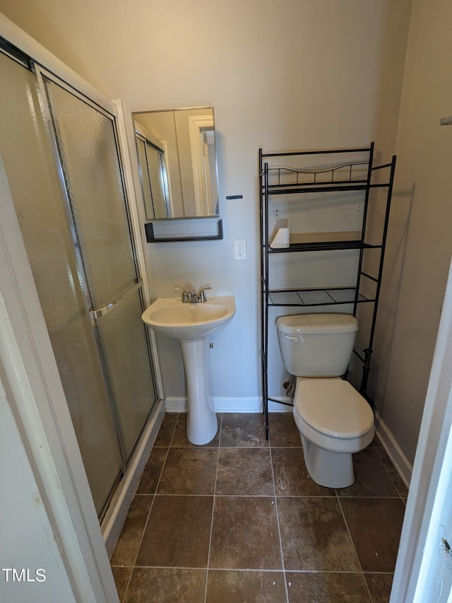 bathroom with toilet and walk in shower