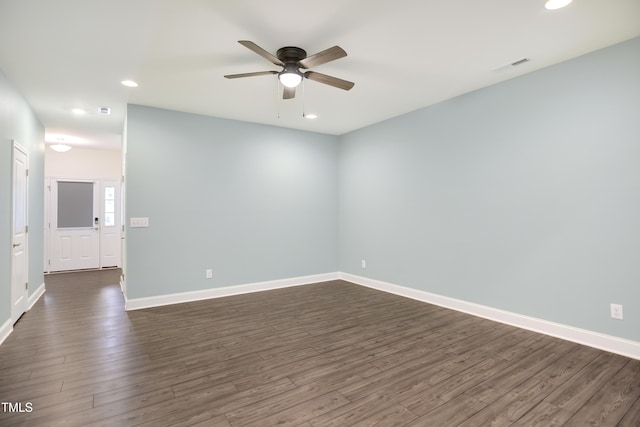 empty room featuring ceiling fan and dark hardwood / wood-style floors