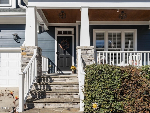 view of exterior entry featuring a porch