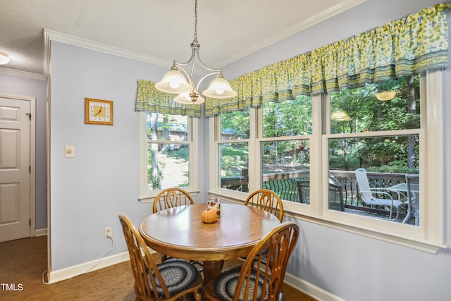 dining area featuring crown molding, hardwood / wood-style floors, an inviting chandelier, and a textured ceiling