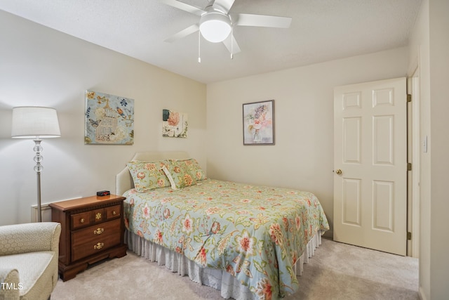 bedroom with light colored carpet and ceiling fan