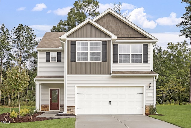 view of front of property featuring a garage and a front yard