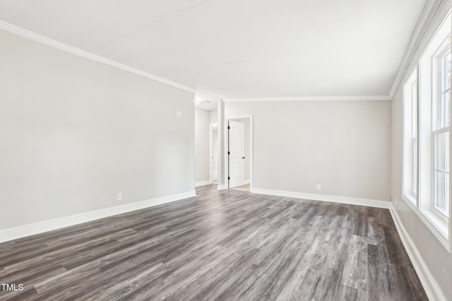 empty room featuring crown molding, plenty of natural light, and dark wood-type flooring