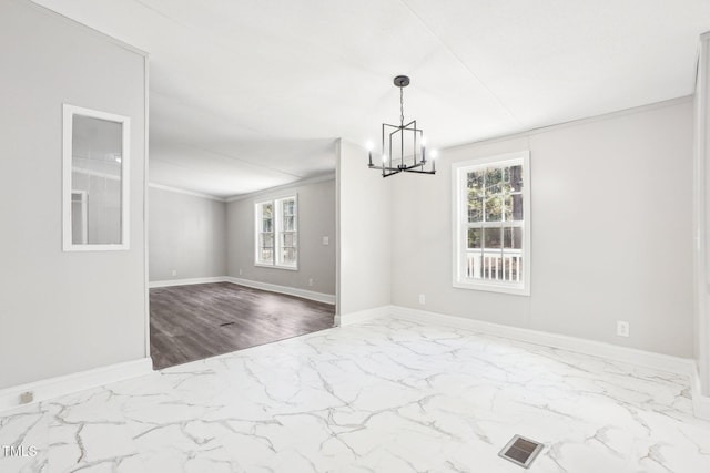 interior space featuring an inviting chandelier and ornamental molding