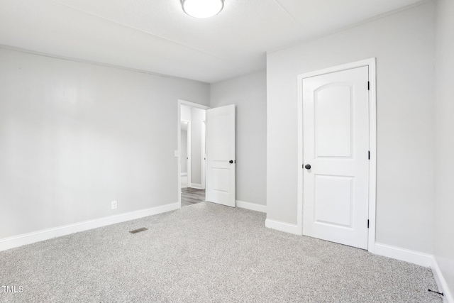 unfurnished bedroom featuring carpet floors