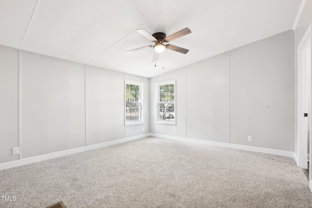 empty room with carpet flooring, ceiling fan, and lofted ceiling