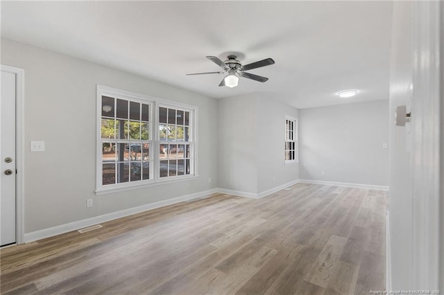 empty room featuring ceiling fan and wood-type flooring