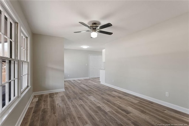 spare room featuring ceiling fan and hardwood / wood-style flooring