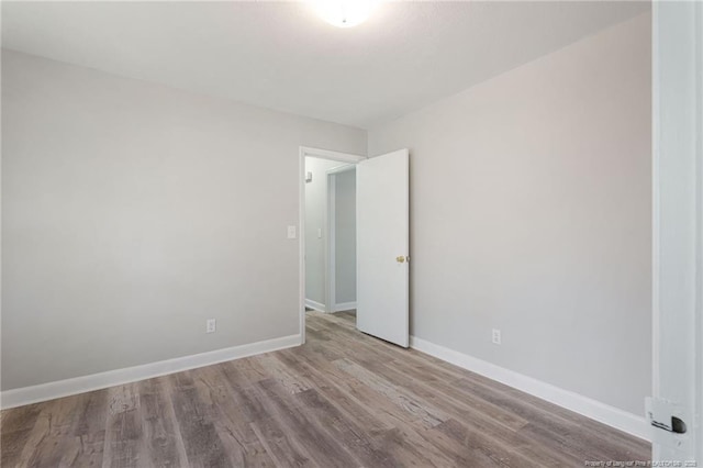 spare room featuring light hardwood / wood-style flooring