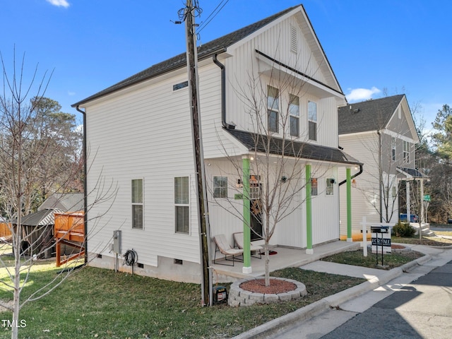 view of property exterior featuring a lawn