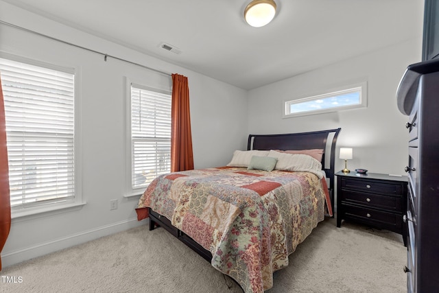 bedroom with light carpet