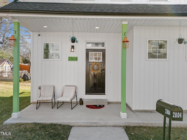 entrance to property with a yard