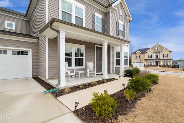 view of front of house with a porch and a garage