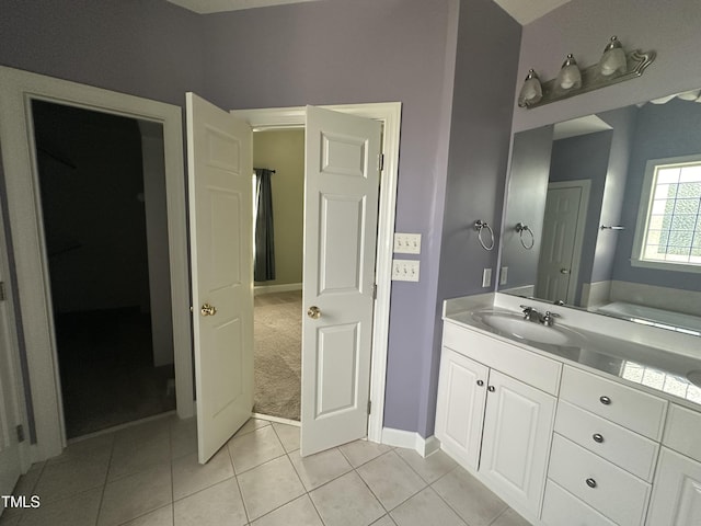 bathroom featuring tile patterned flooring and vanity