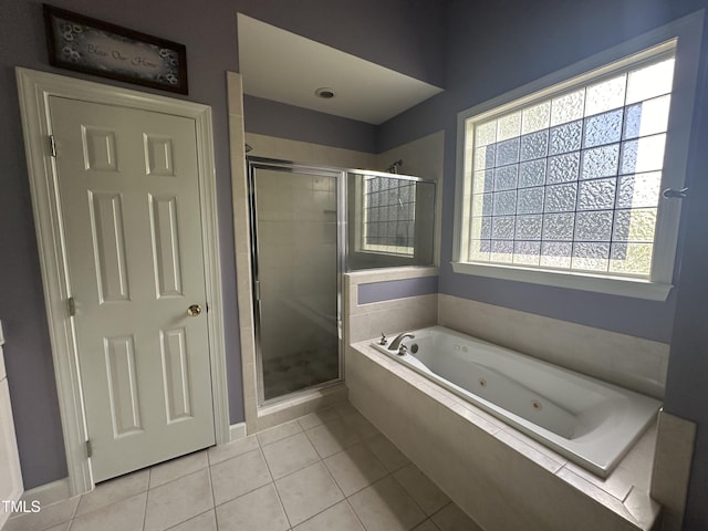 bathroom featuring tile patterned flooring and independent shower and bath