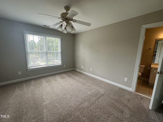 empty room featuring ceiling fan and carpet floors