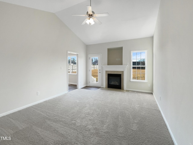 unfurnished living room featuring carpet flooring, high vaulted ceiling, and ceiling fan