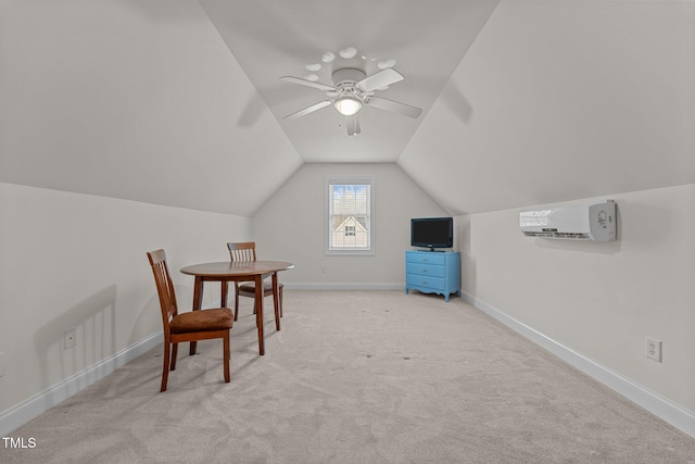 interior space featuring ceiling fan, a wall mounted air conditioner, light colored carpet, and lofted ceiling