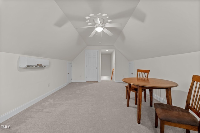 interior space featuring an AC wall unit, ceiling fan, light colored carpet, and lofted ceiling