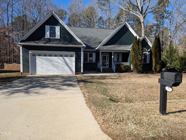 view of front of house featuring covered porch and a garage