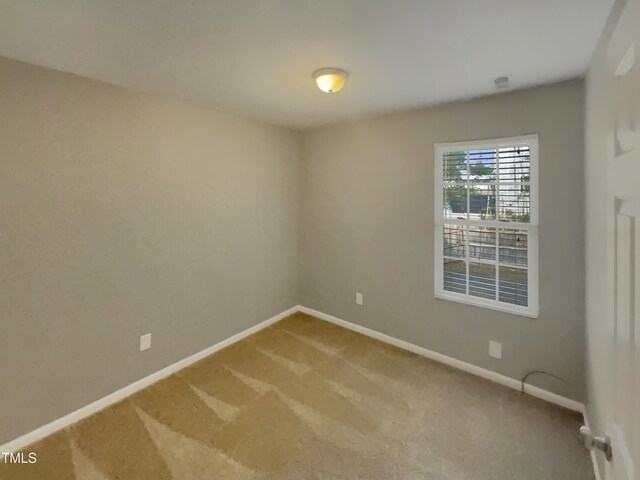 311 Burnette St, Durham, NC 27707 - carpeted spare room featuring baseboards