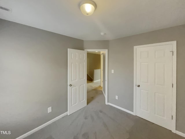 311 Burnette St, Durham, NC 27707 - unfurnished bedroom featuring carpet flooring and baseboards