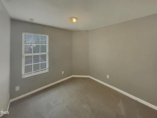 311 Burnette St, Durham, NC 27707 - carpeted spare room featuring baseboards