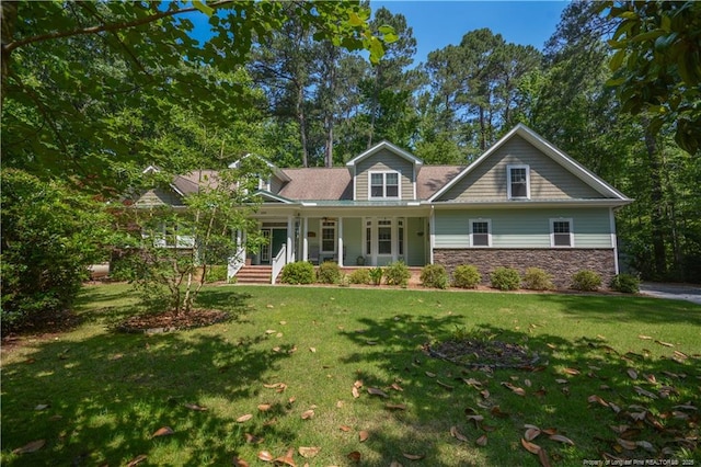 654 Titmouse Ct, Vass, NC 28394 - view of front of home featuring covered porch, stone siding, and a front lawn