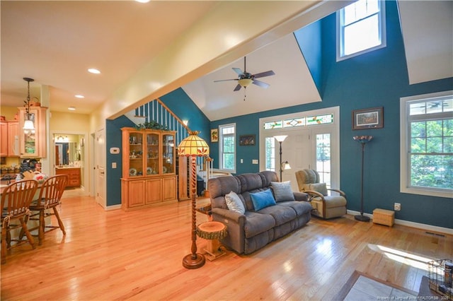 654 Titmouse Ct, Vass, NC 28394 - living room with light wood-style floors, stairway, healthy amount of natural light, a ceiling fan, and recessed lighting