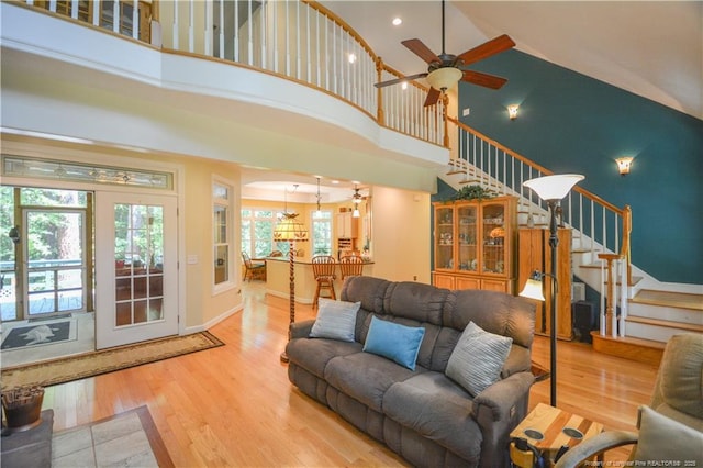 654 Titmouse Ct, Vass, NC 28394 - living room with high vaulted ceiling, stairs, wood finished floors, a ceiling fan, and recessed lighting