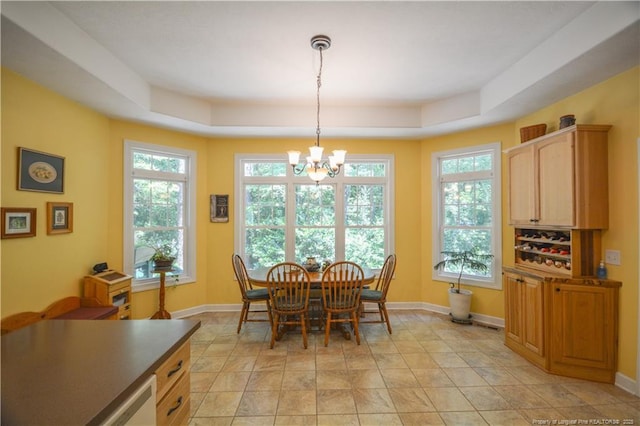 654 Titmouse Ct, Vass, NC 28394 - dining space featuring a chandelier and a tray ceiling